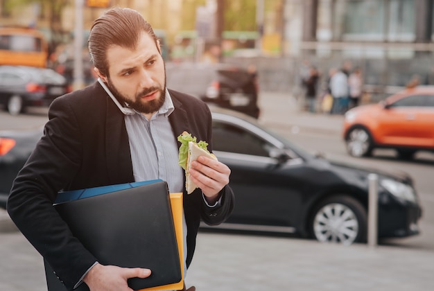 Businessman doing multiple tasks. Multitasking business person.