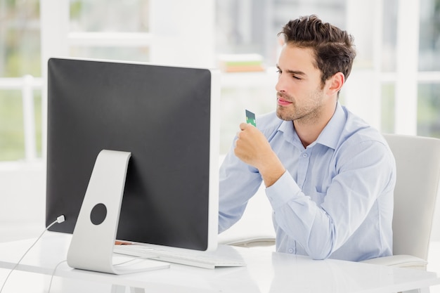 Businessman doing online shopping on computer