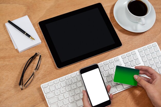 Businessman doing online shopping on mobile phone