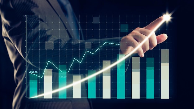 Businessman draw finance allusive graph chart showing business profit growth