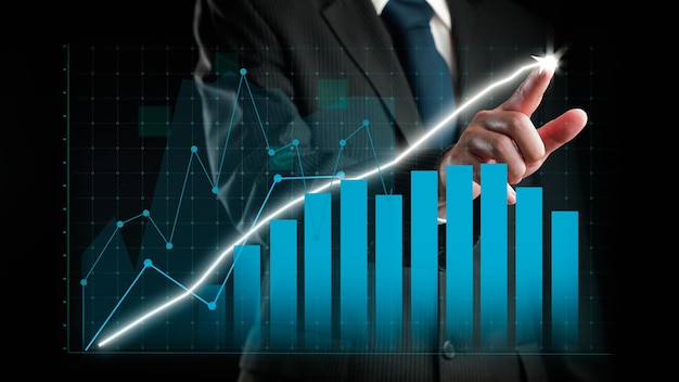 Businessman draw finance allusive graph chart showing business profit growth