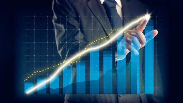 Businessman draw finance allusive graph chart showing business profit growth