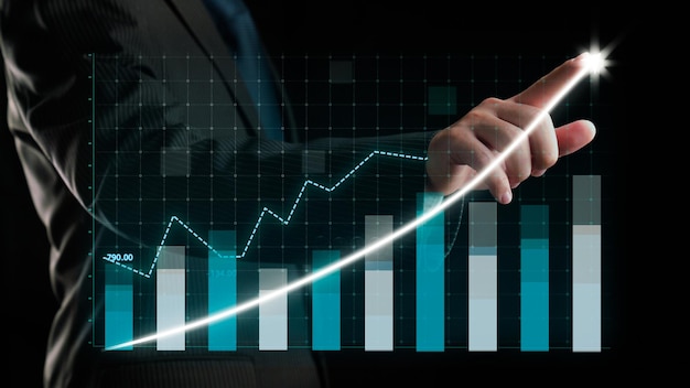 Businessman draw finance allusive graph chart showing business profit growth