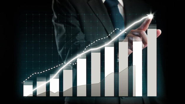 Businessman draw finance allusive graph chart showing business profit growth