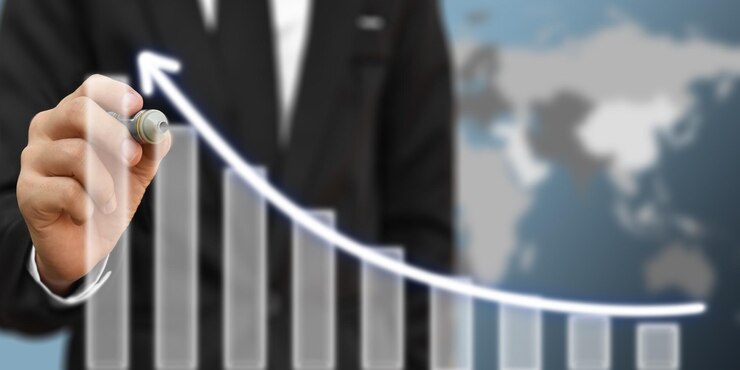 Businessman drawing arrow on screen graph corporate future growth plan Concept of business development and growth Elements of this image furnished by NASA