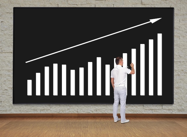 Businessman drawing chart