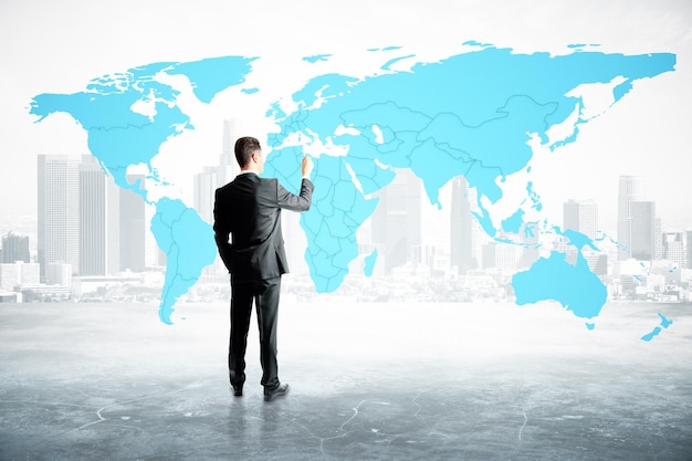 businessman drawing map
