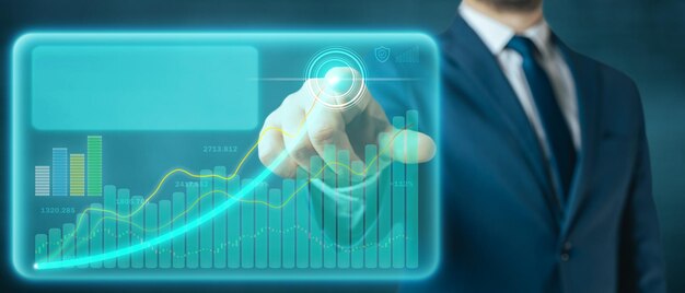 Businessman draws growing graph of business sales on a virtual screen Futuristic business marketing and finance concept with copyspace