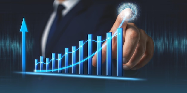 Businessman draws growth graph of business Business development and planning success concept