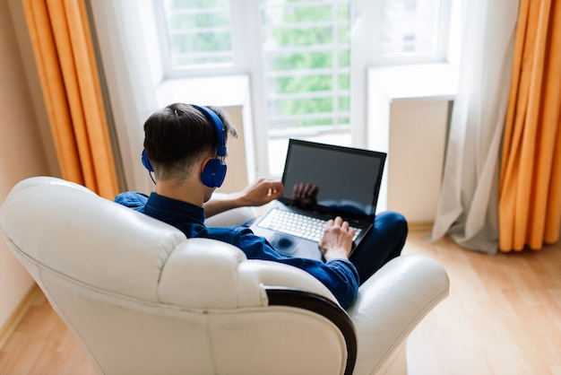 Businessman dressed in shirt having video call on computer in the home office, isolation