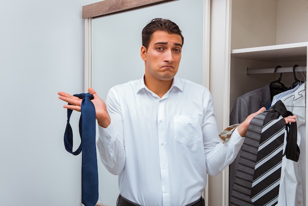 Businessman dressing up for work