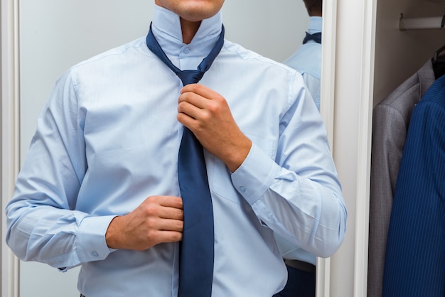 Businessman dressing up for work