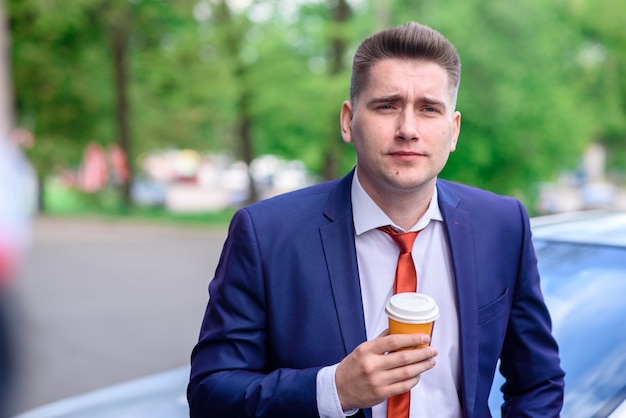 Businessman drinking coffee.