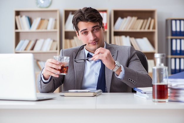 Businessman drinking in the office