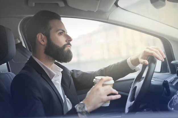 Businessman driving a car