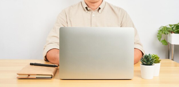 businessman or entrepreneur concept. Asian man using a laptop communicates and work on internet