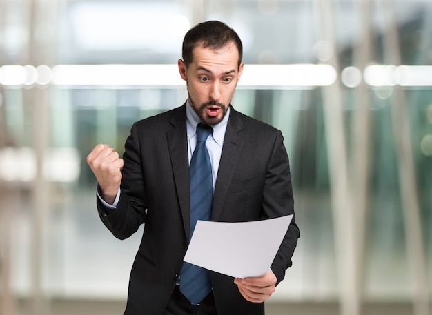 Businessman excited for a document