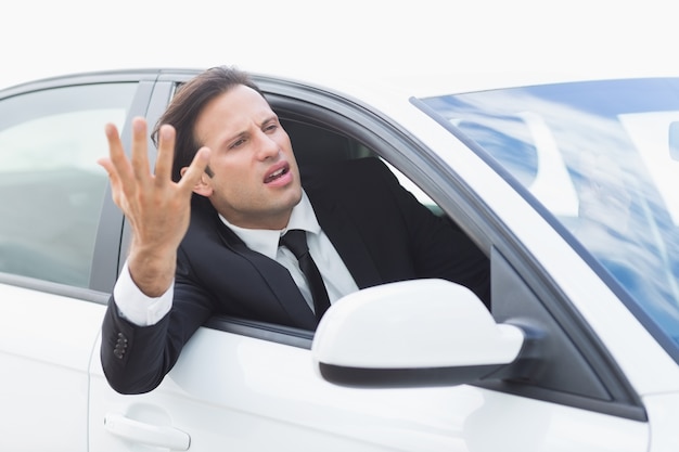 Businessman experiencing road rage