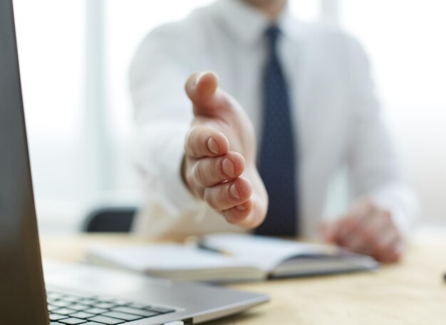 Businessman extending hand to shake