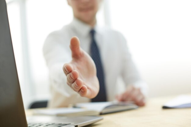 Businessman extending hand to shake