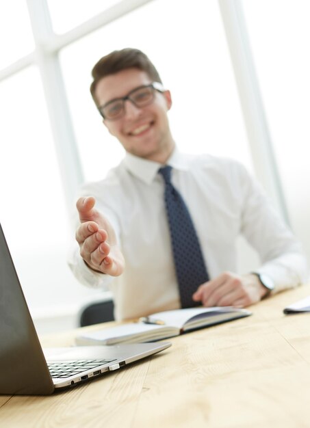 Businessman extending hand to shake