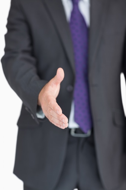 Businessman extending hand