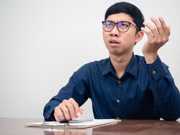 Businessman feels serious with hard working on table