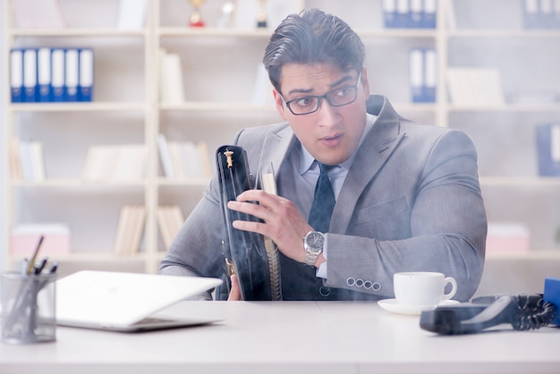 Businessman during fire alarm in office