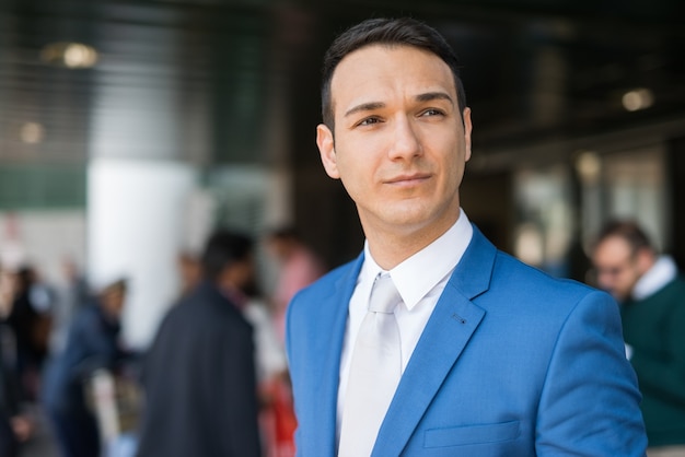 Businessman in front of an airport entrance