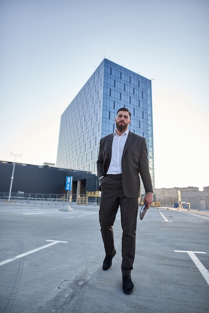 businessman in front of corporate buildings