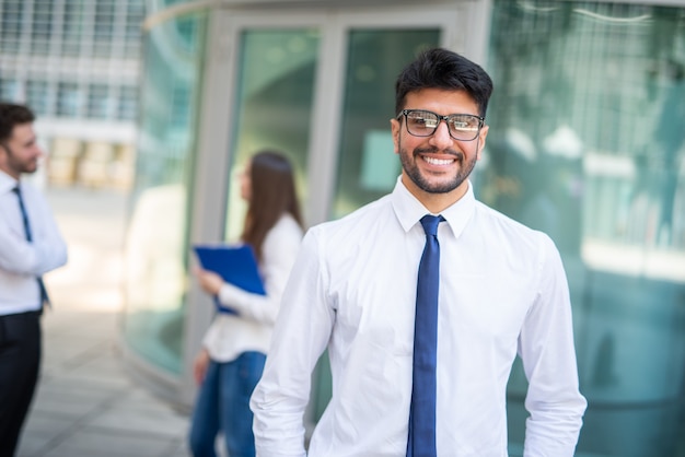 Businessman in front of a group of colleagues, teamwork concept