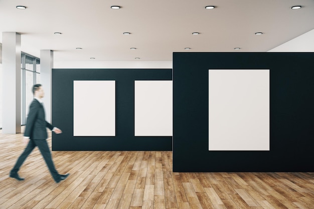 Businessman in gallery with poster