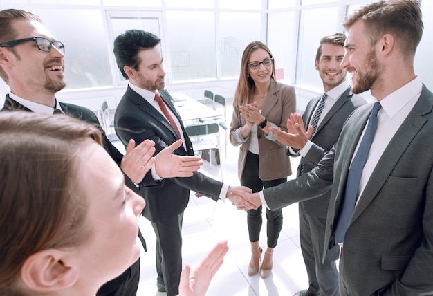 Businessman giving his hand for handshake to partner