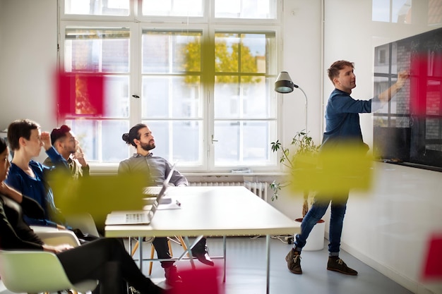 Photo businessman giving presentation inside boardroom