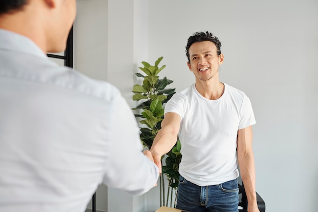 Businessman greeting project manager