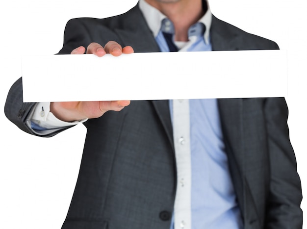 Businessman in grey suit showing card