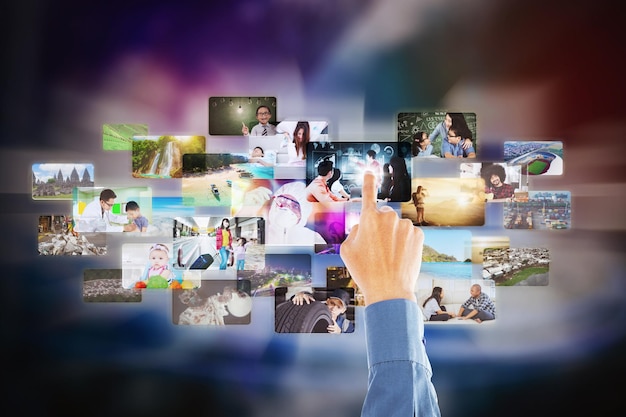 businessman hand choosing pictures for project