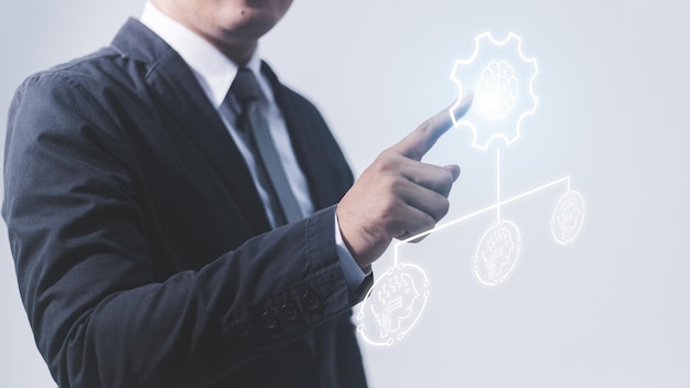 Foto icona dell'ingranaggio dell'illustrazione della mano dell'uomo d'affari sullo schermo virtuale concetto di business e tecnologia
