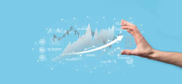 Photo businessman in hand hold banking business finance graph and invest in stock market investment point,economic growth and investor concept.analysis virtual stock market chart,analyze by use technology