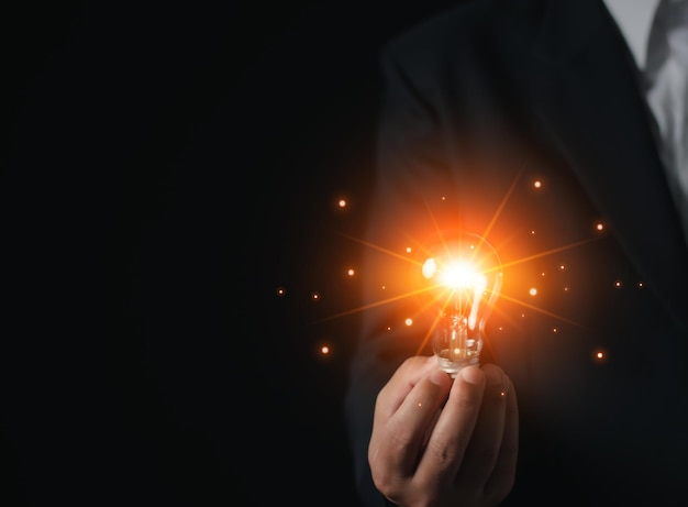 Businessman hand hold light bulb for good idea brainstorming creative idea Inspiration