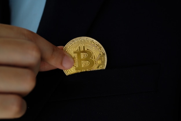 Businessman hand holding bitcoins