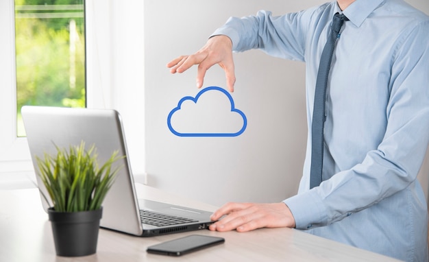 Businessman hand holding cloud.cloud computing concept, close\
up of young business man with cloud over his hand.the concept of\
cloud service.