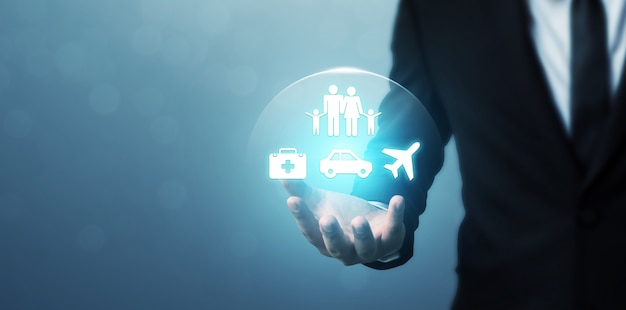 Businessman hand showing icon people family, health, car and airplane