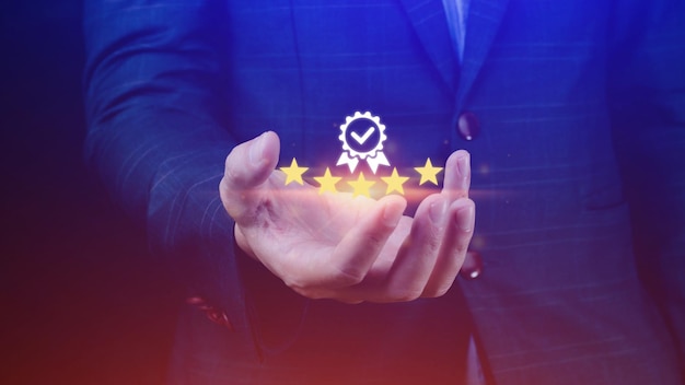 businessman hand shows the sign of the top service quality assurance 5 star guarantee best product standards iso certification and standardization concept