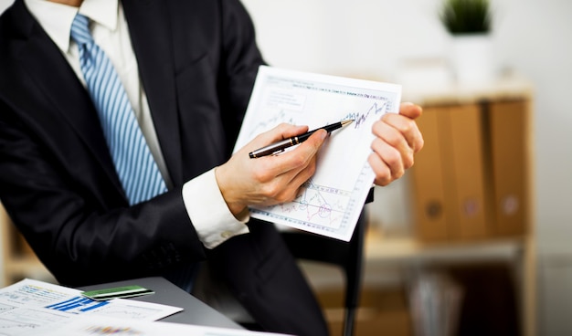 Businessman hands are holding the touch screen device.