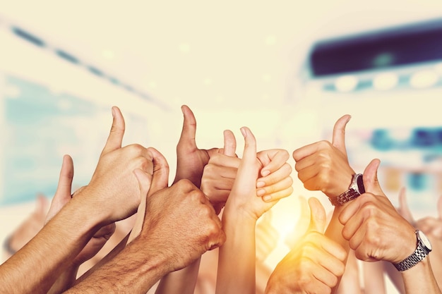 Businessman Hands raising thumbs finger up