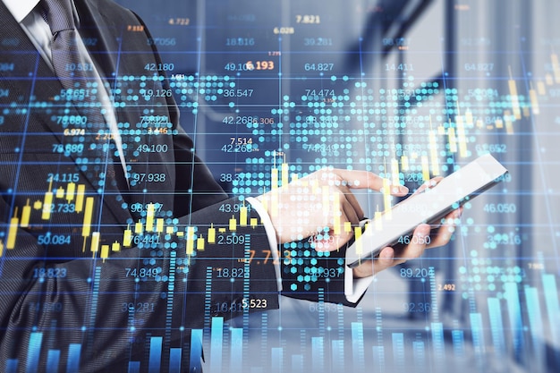 businessman hands using cellphone with creative forex chart with candlestick graph