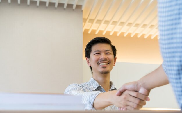 Photo businessman handshake with partner,