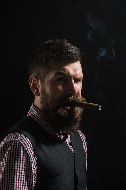 Businessman has five minute break for smokes harmful habit
bearded caucasian man smoking cigar