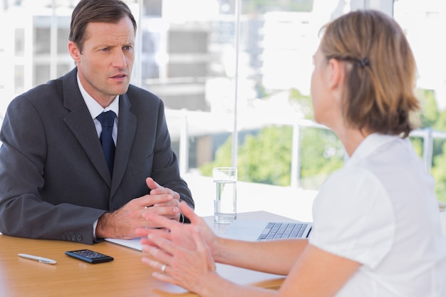 Businessman having a discussion with a job applicant